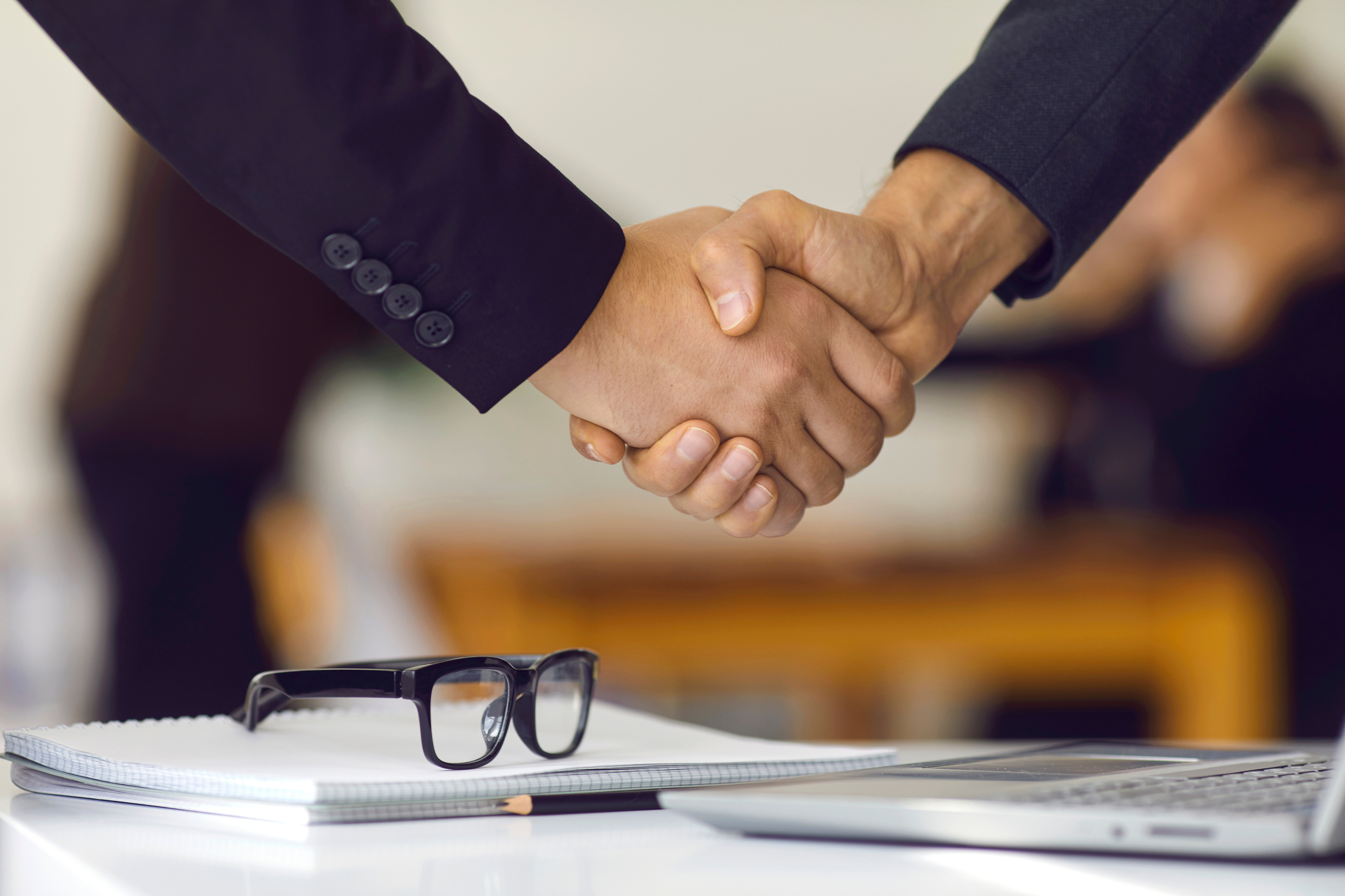 Business partnership handshake